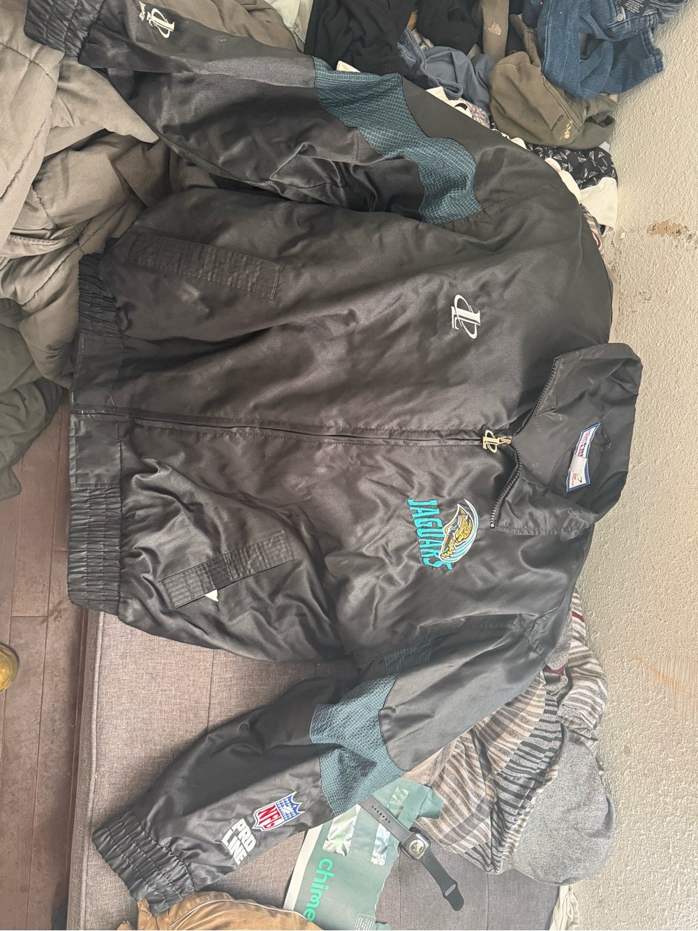 Jacksonville Jaguars Black Satin Windbreaker Jacket by Starter